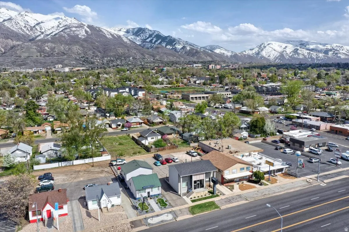 Aerial perspective of suburban area with a mountainous background