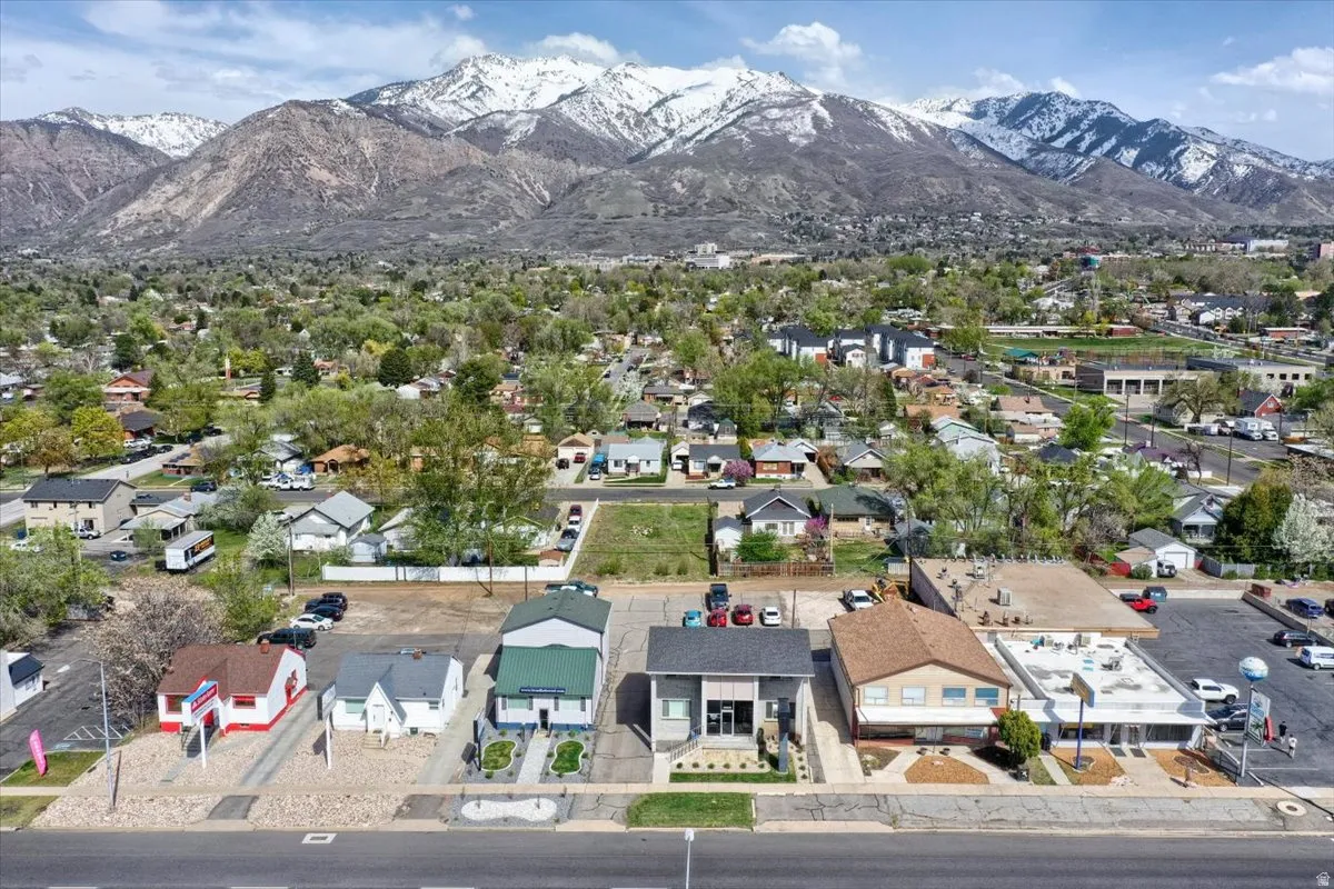 Aerial perspective of suburban area with a mountain backdrop