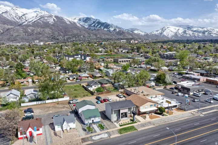 Aerial perspective of suburban area with a mountainous background