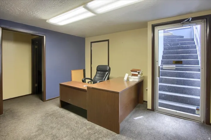 Office featuring a textured ceiling