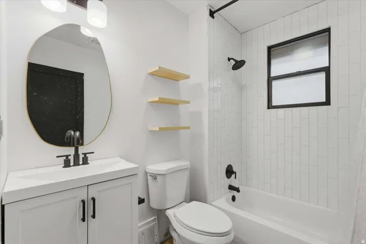 Bathroom featuring shower / bathtub combination and vanity