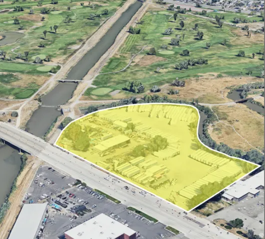 Aerial perspective highlighting a commercial property with extensive paved areas