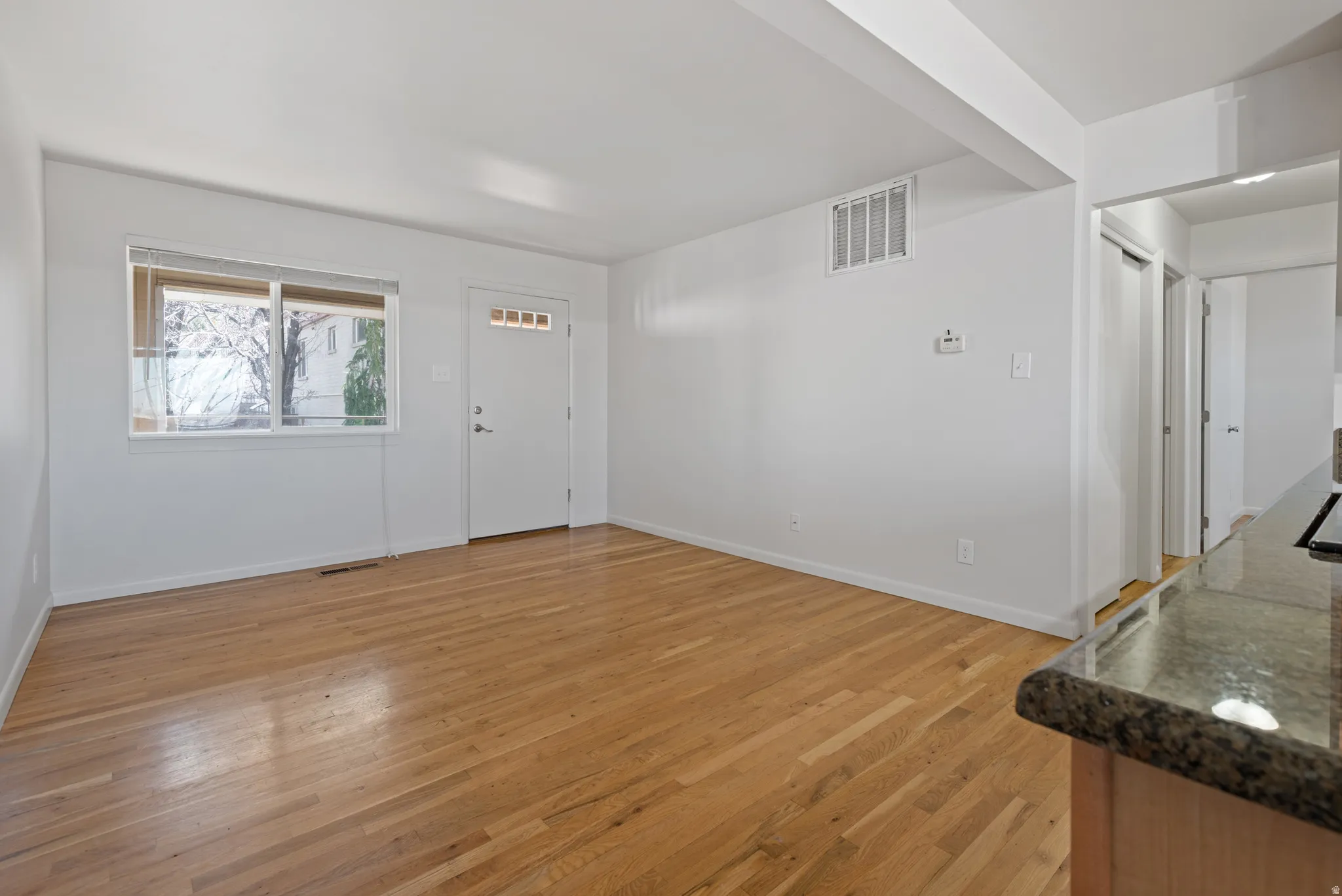 Foyer featuring light wood-style flooring