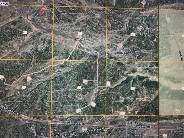 Aerial map of property and surrounding area featuring property parcel outlined