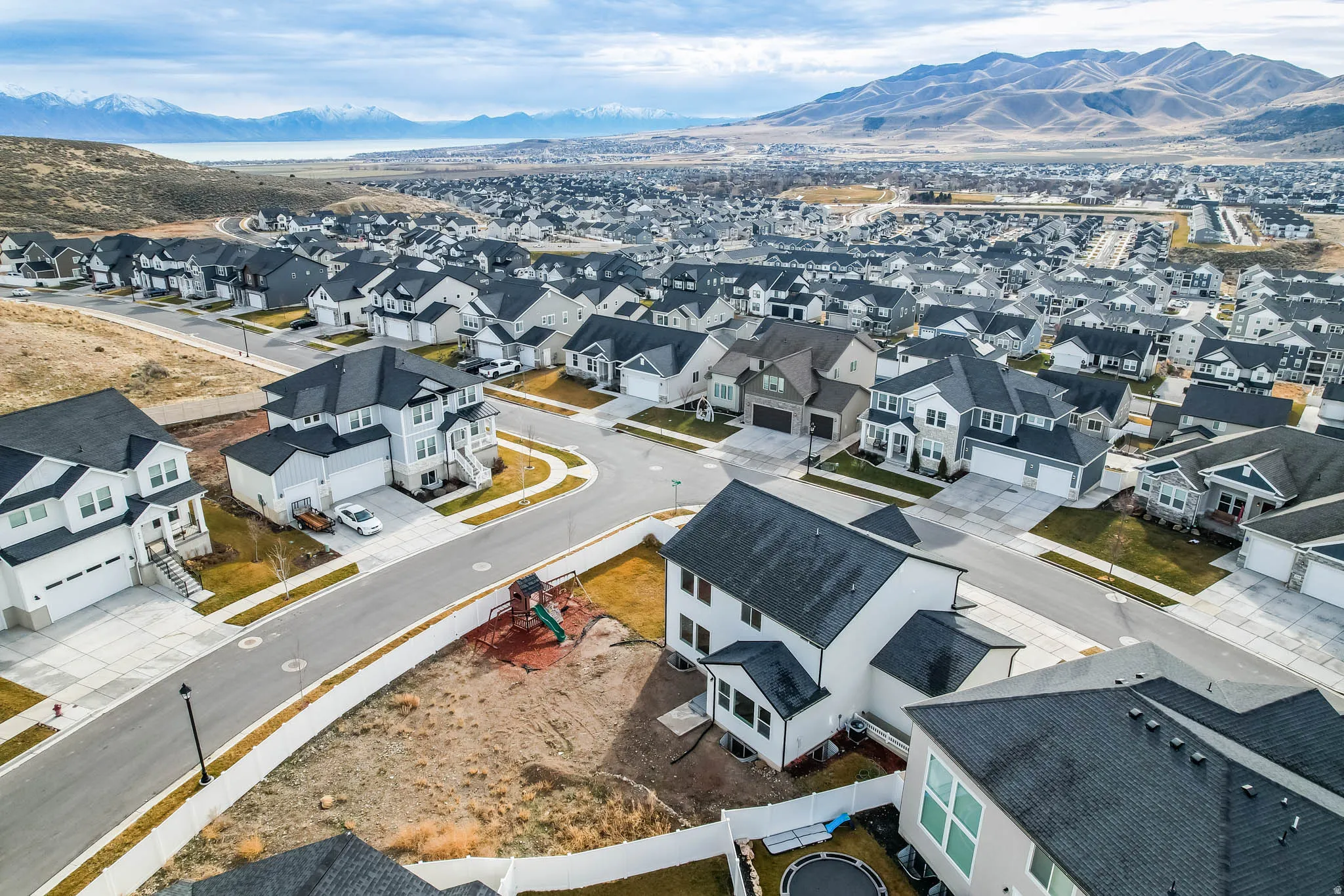 Aerial view of residential area with a mountain backdrop