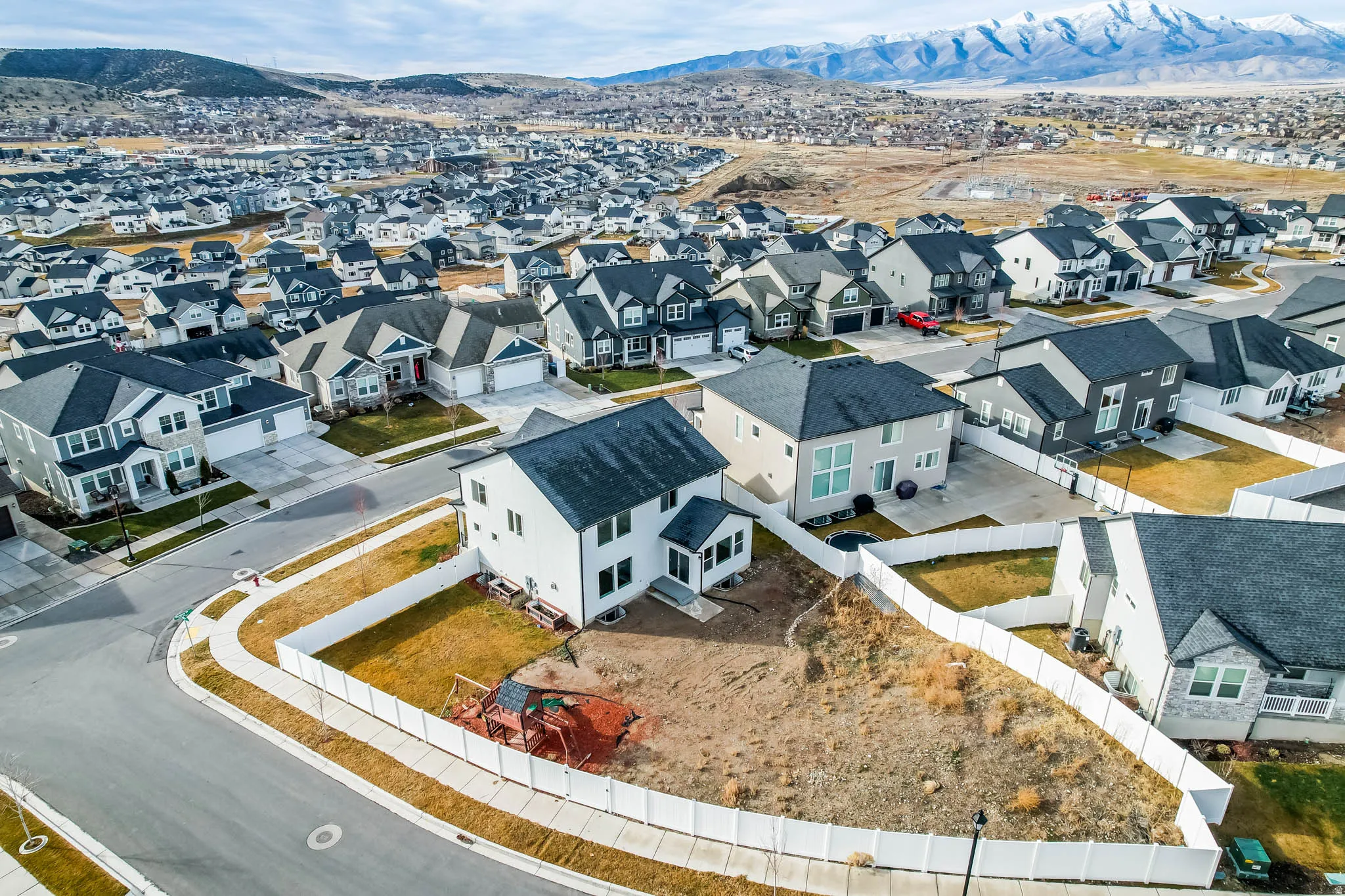Aerial perspective of suburban area with mountains