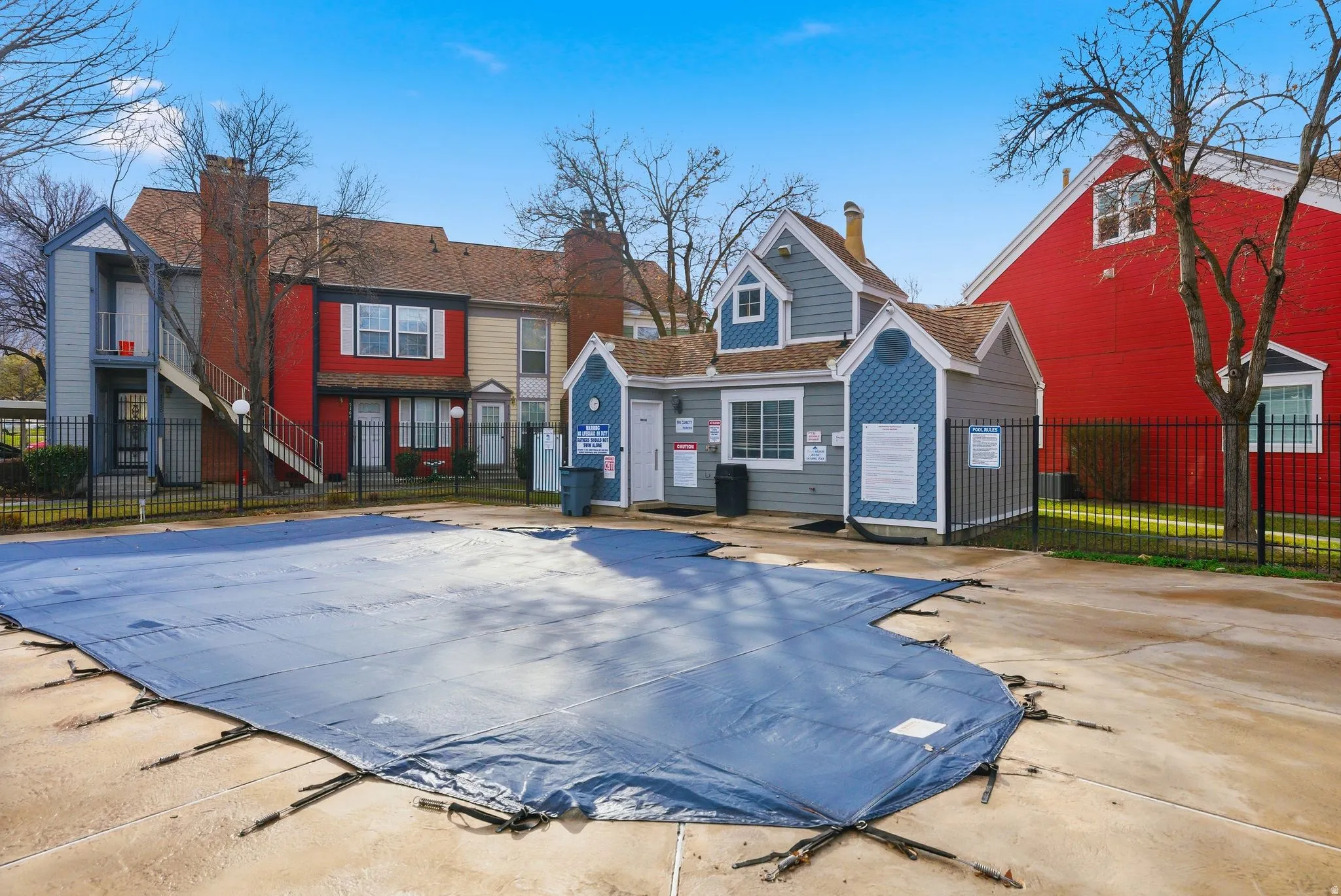 Back of house with a community pool