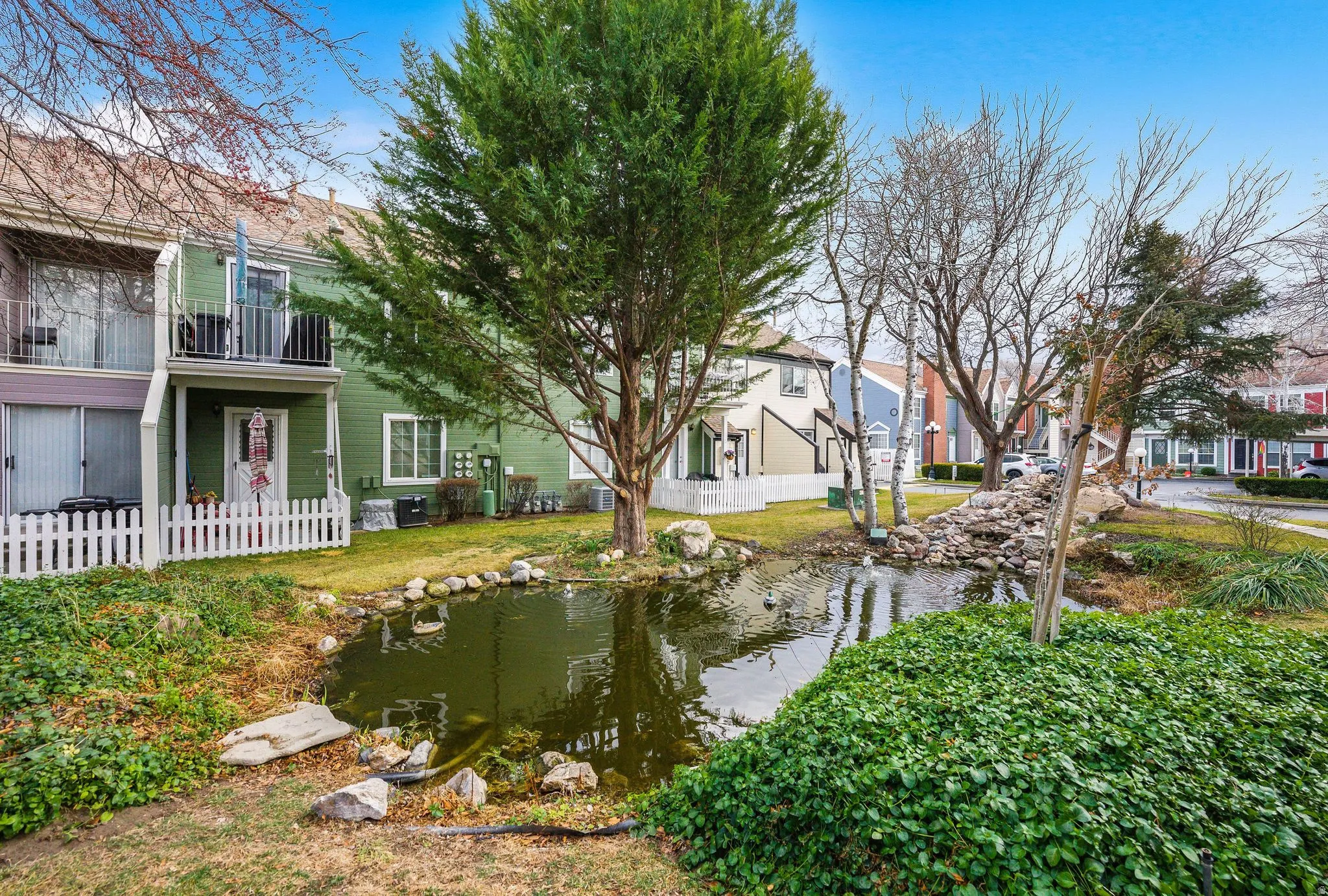 View of yard featuring a residential view and a balcony