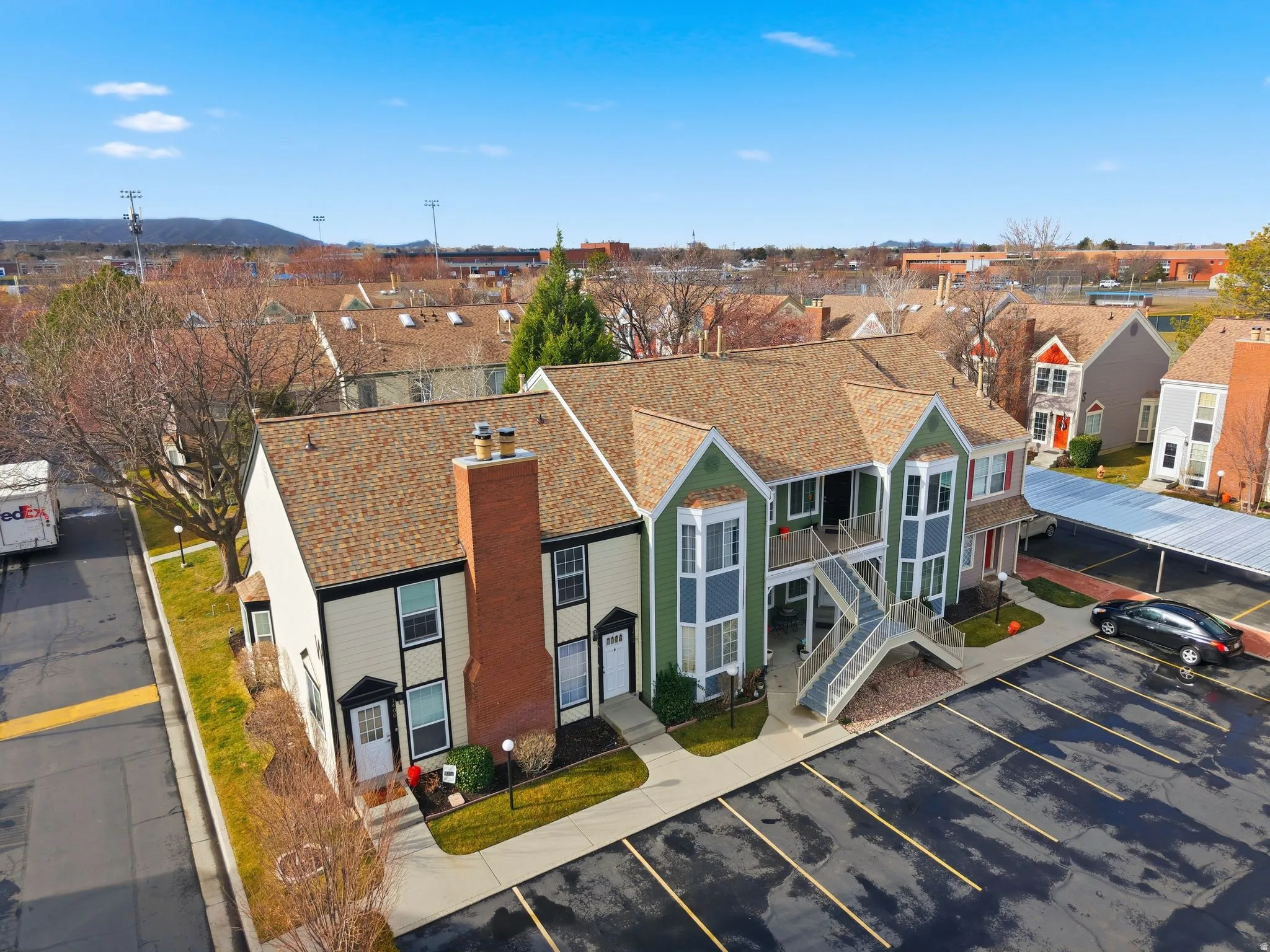 Aerial perspective of suburban area with a mountain backdrop