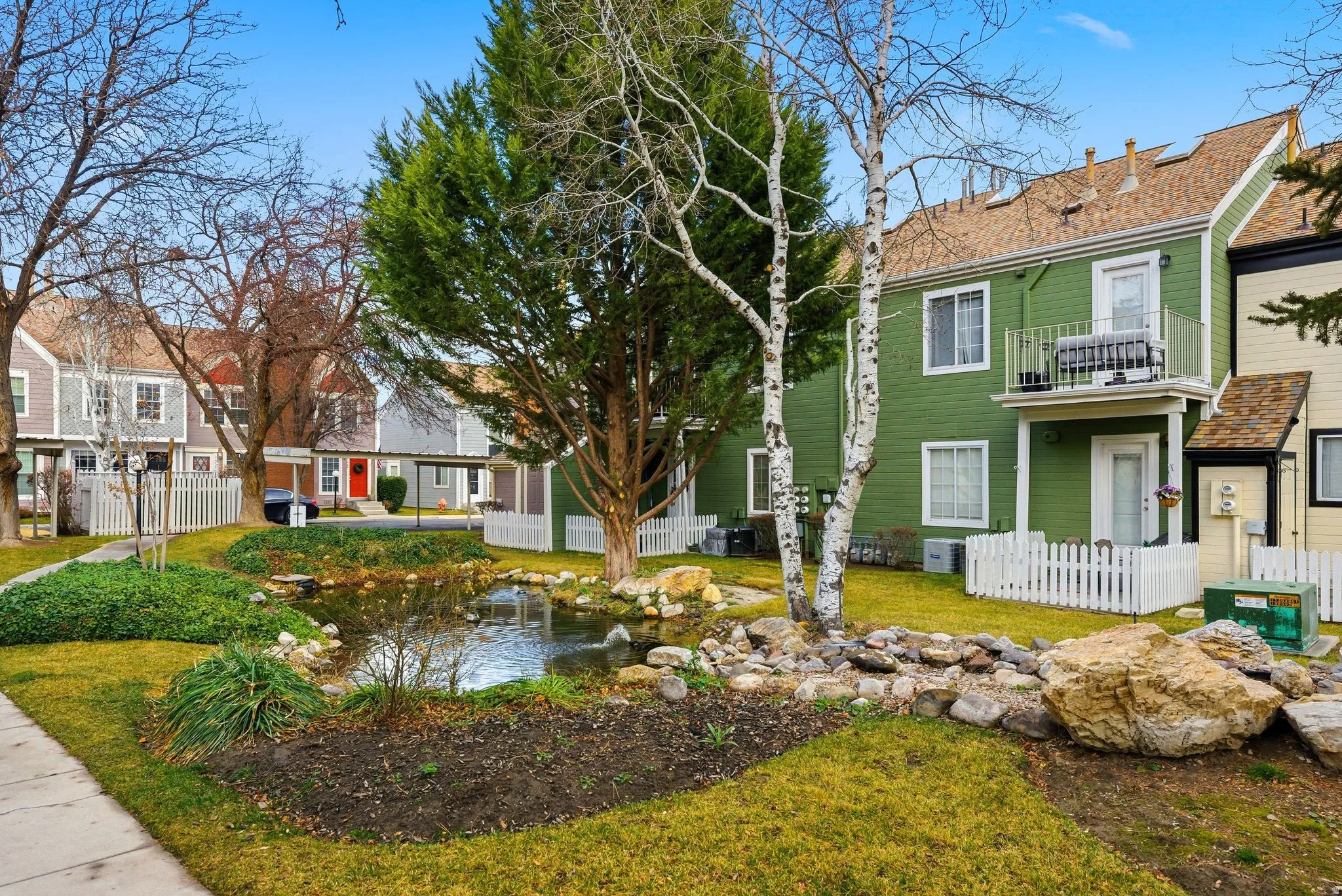 View of front facade with a balcony and a residential view