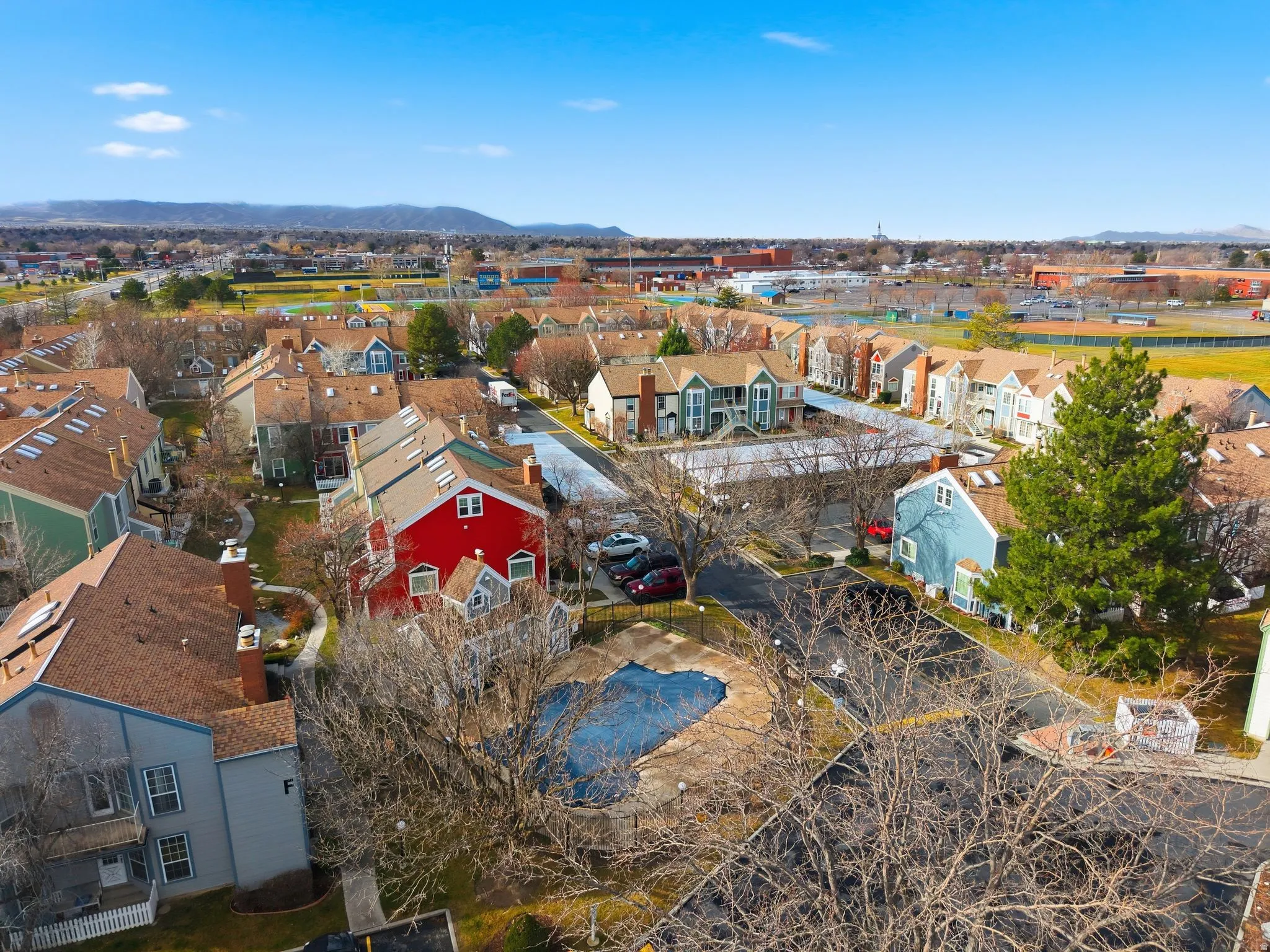 Aerial perspective of suburban area with a mountainous background