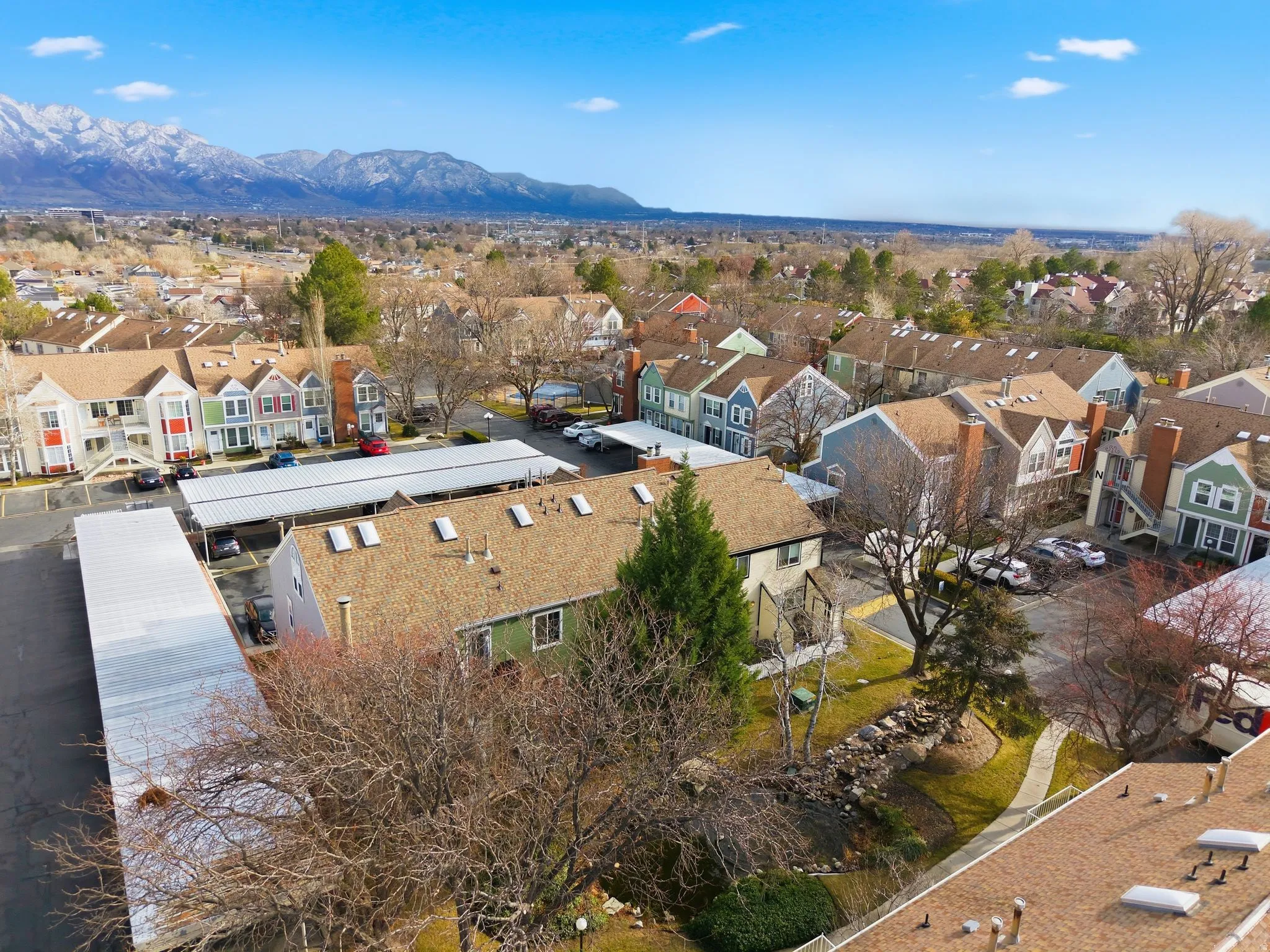 Aerial perspective of suburban area with a mountain backdrop