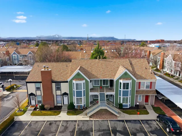 Aerial perspective of suburban area with a mountainous background