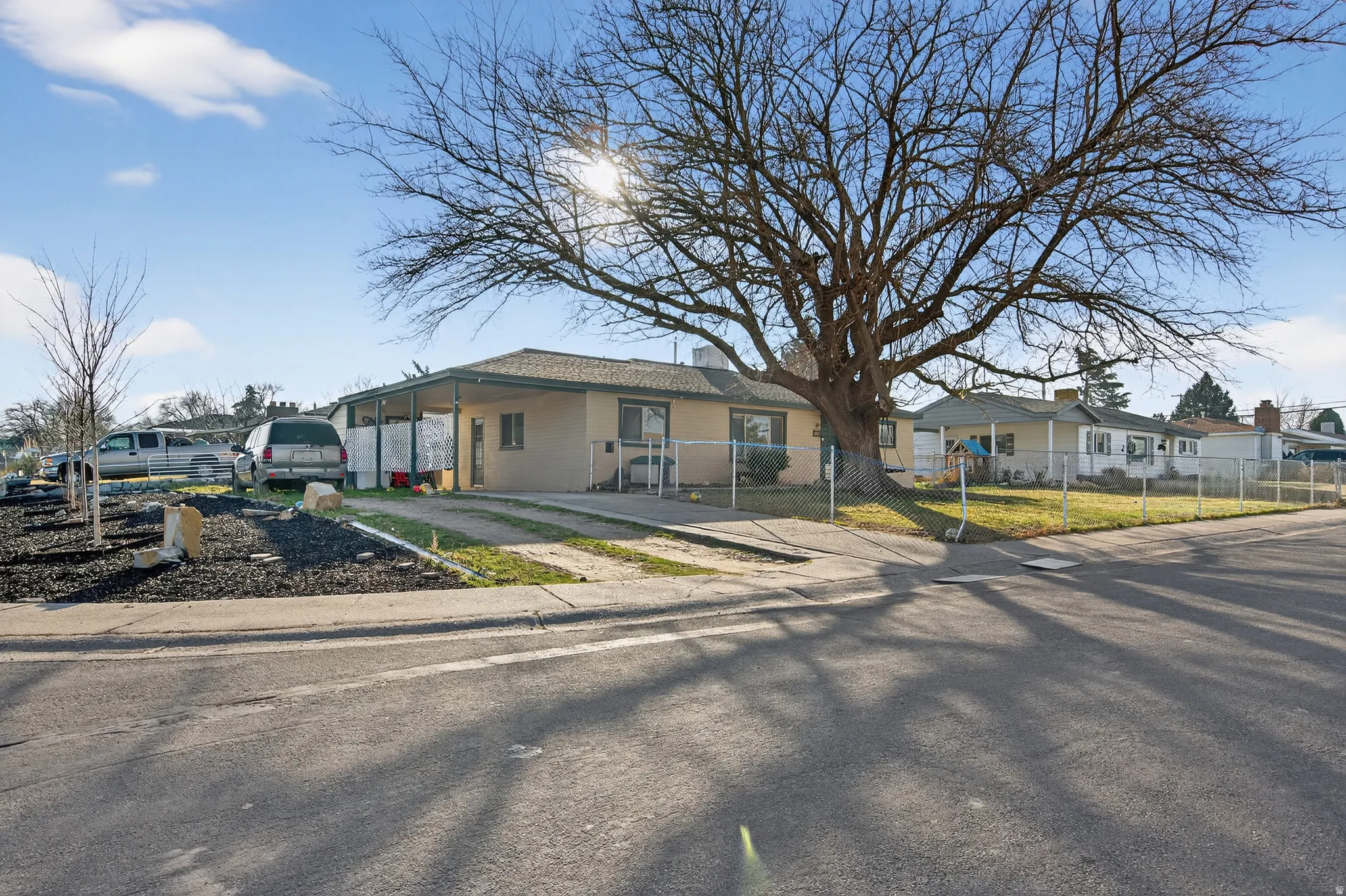 View of front of property with a residential view and a fenced front yard