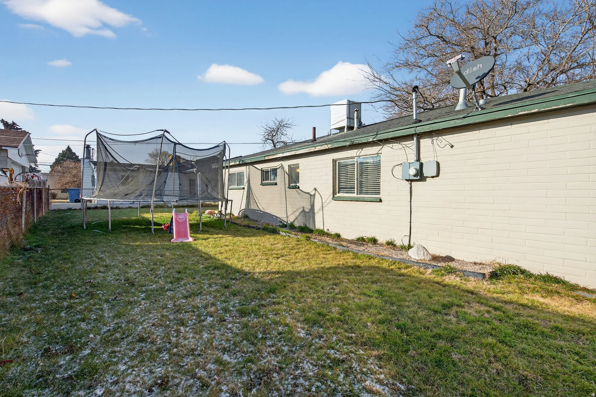 View of yard with a trampoline