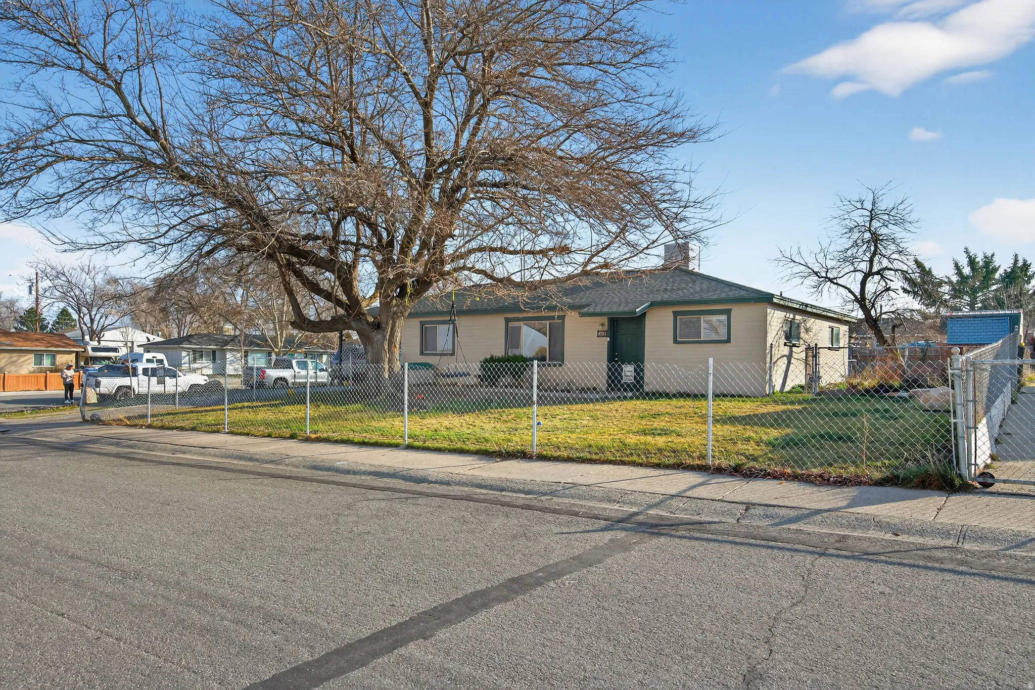 View of front of home featuring a fenced front yard and a chimney