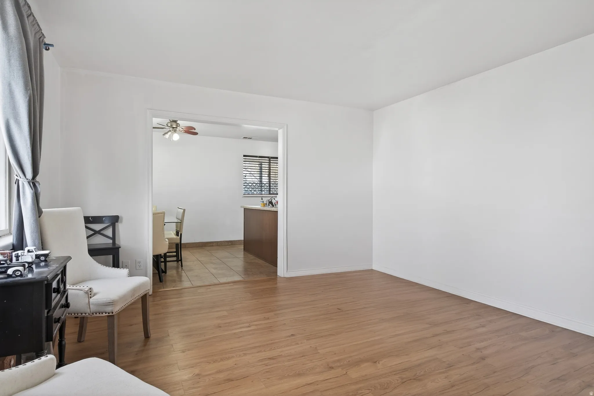 Sitting room featuring light wood finished floors and baseboards