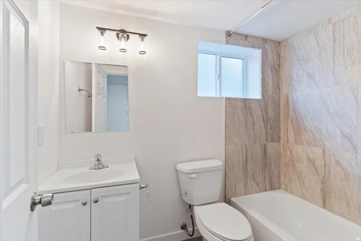 Full bathroom with vanity and  shower combination