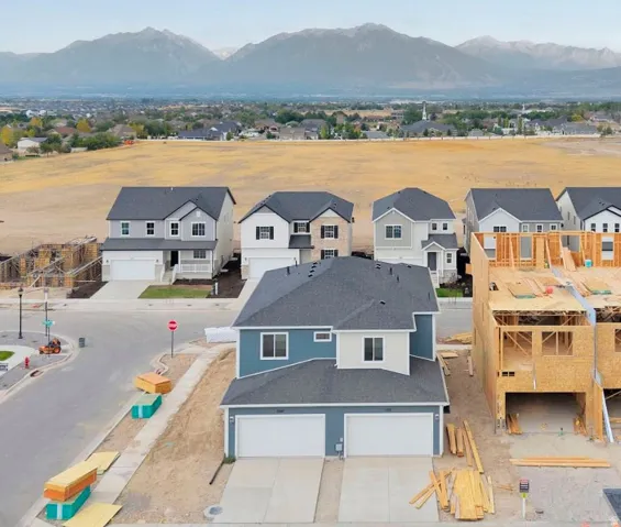 Aerial view of residential area featuring a mountain backdrop