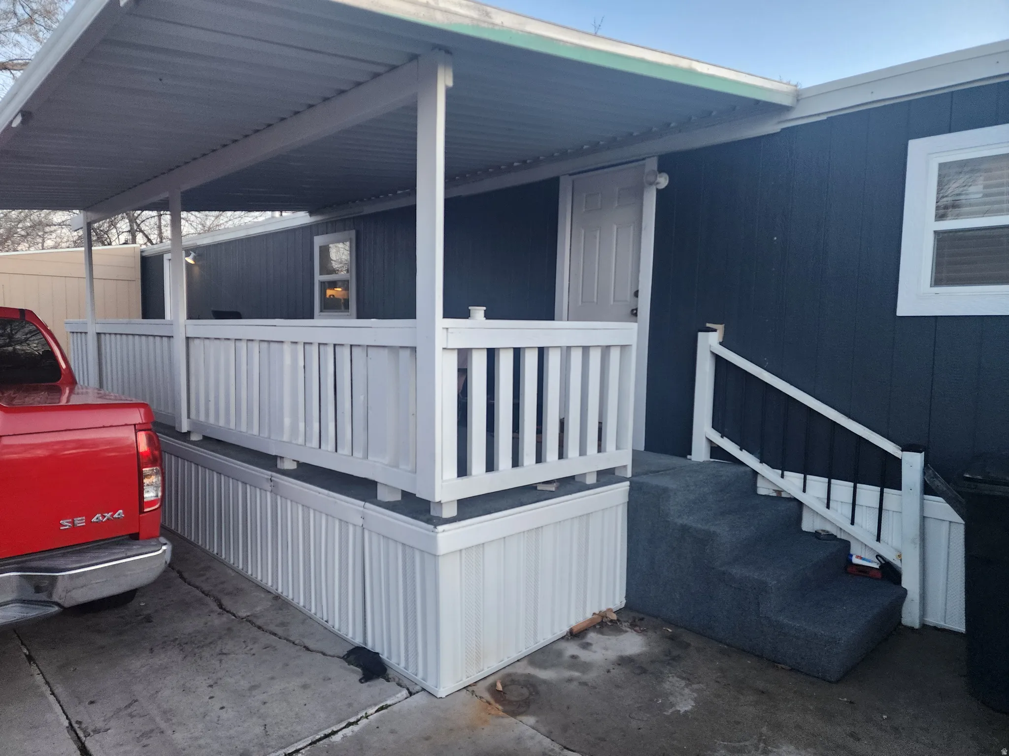Property entrance featuring covered porch