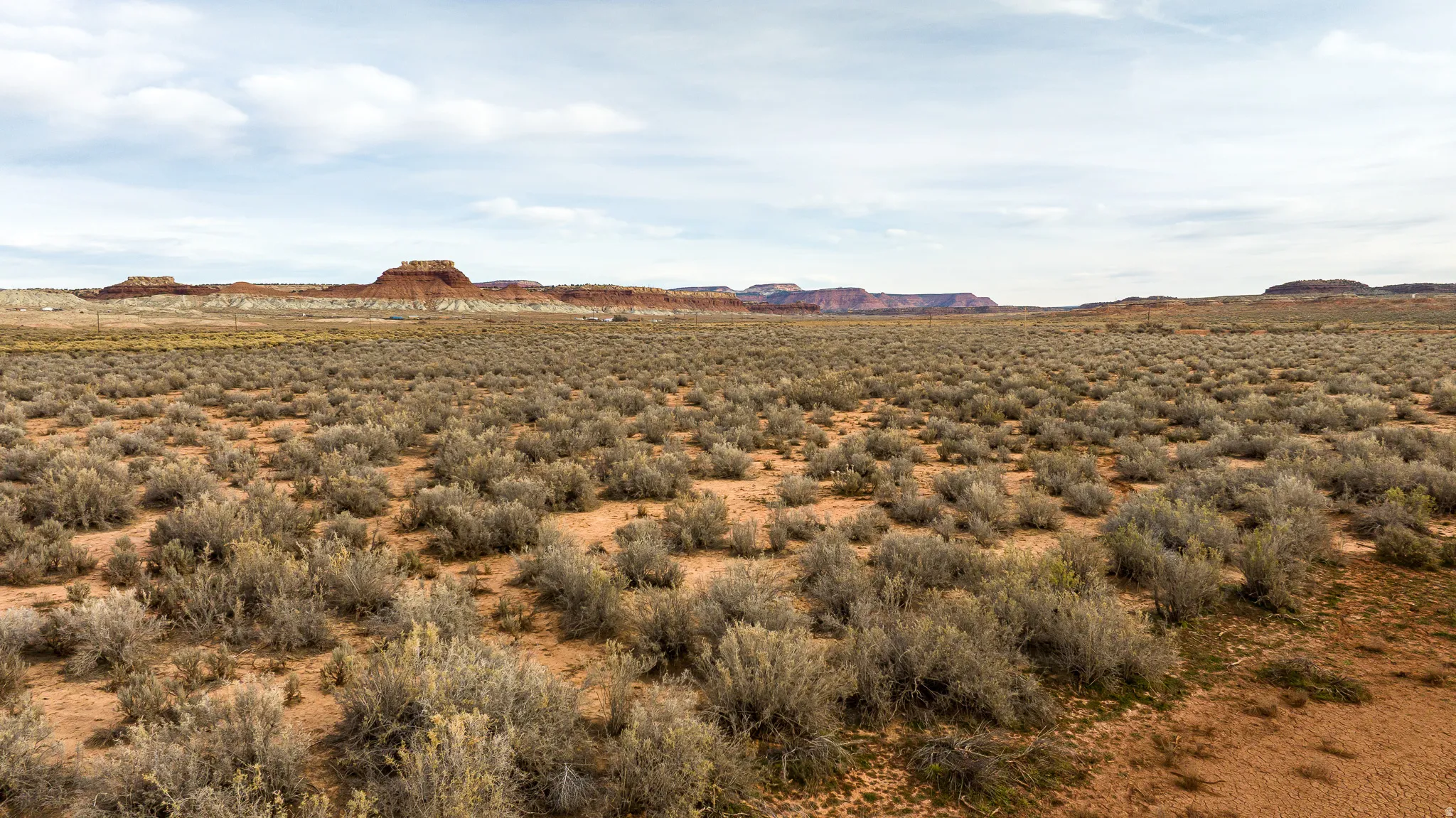 View of mountain backdrop featuring rural landscape