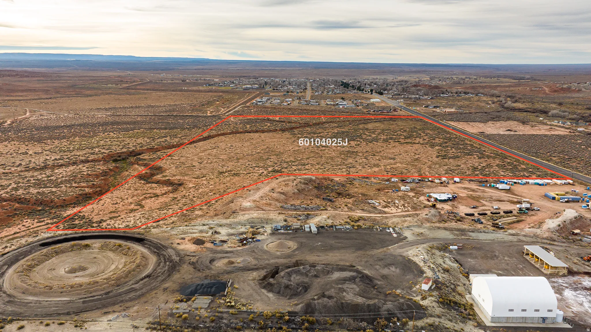 Overview of rural landscape featuring property boundaries highlighted and a desert landscape