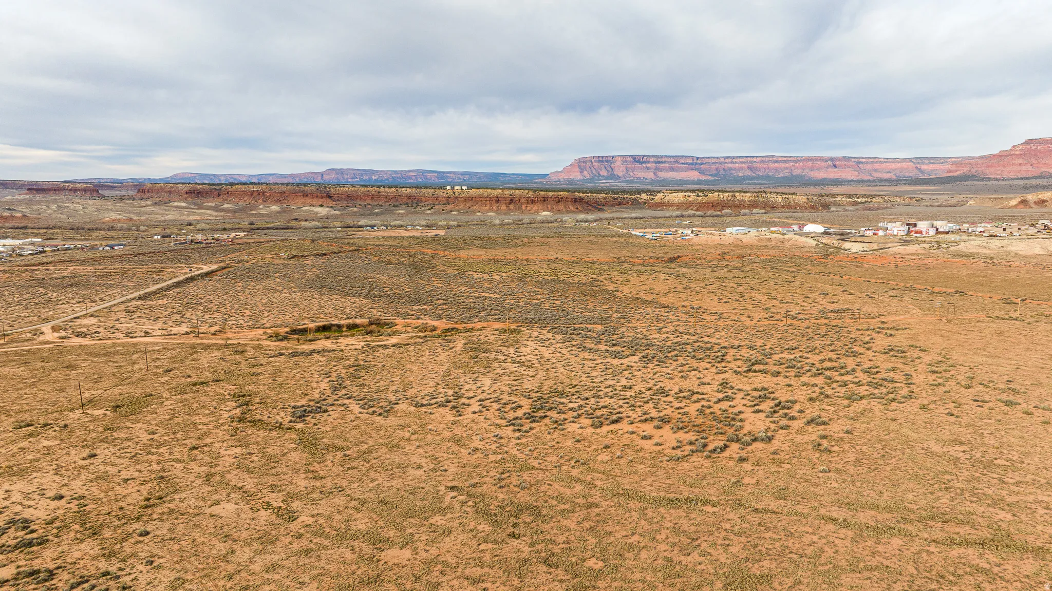 View of mountain backdrop featuring rural landscape and a desert landscape