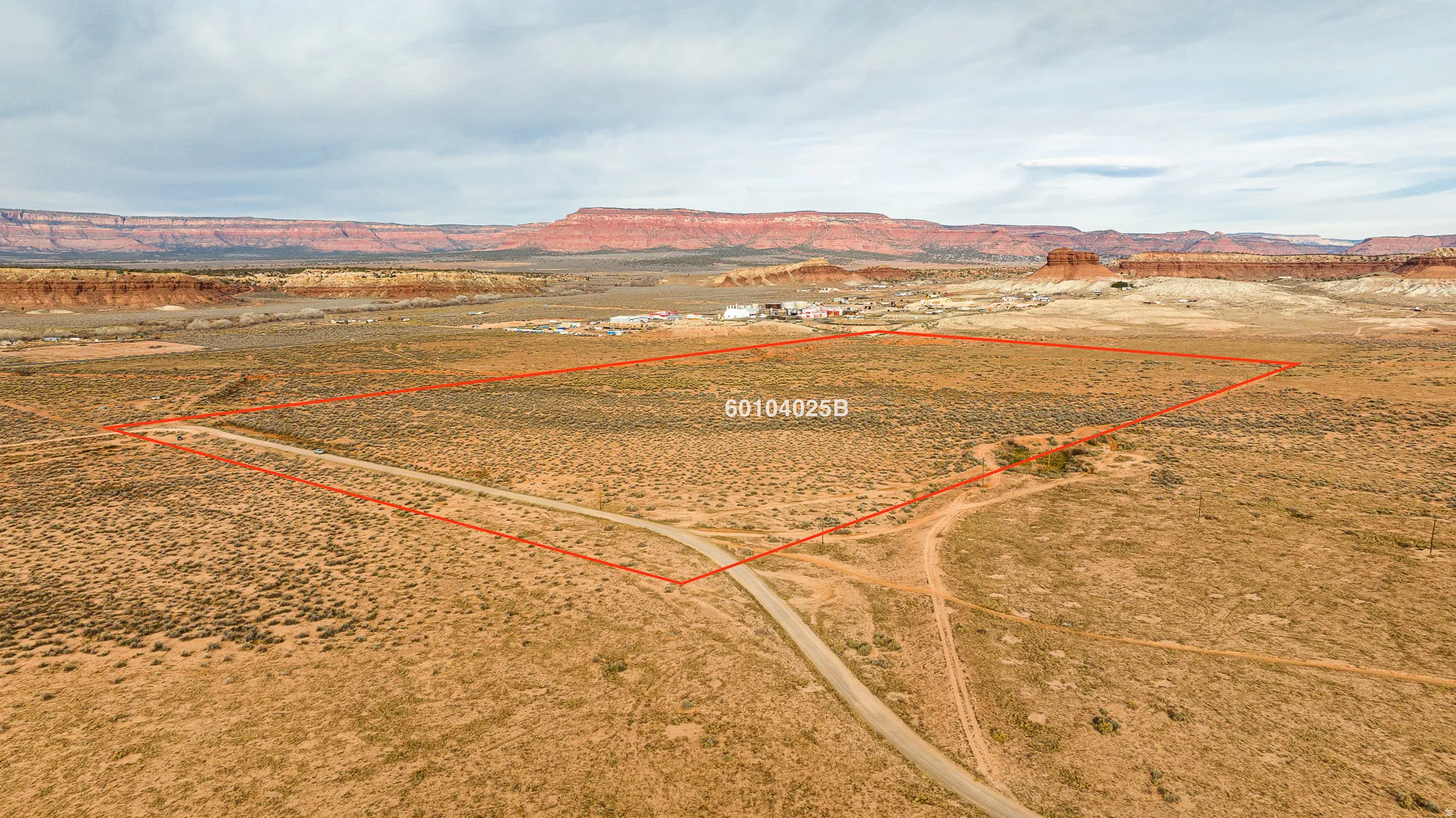 View of rural area with property parcel outlined and mountains