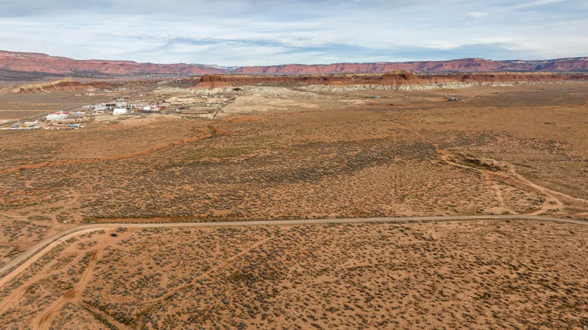 Aerial view of sparsely populated area with a mountainous background