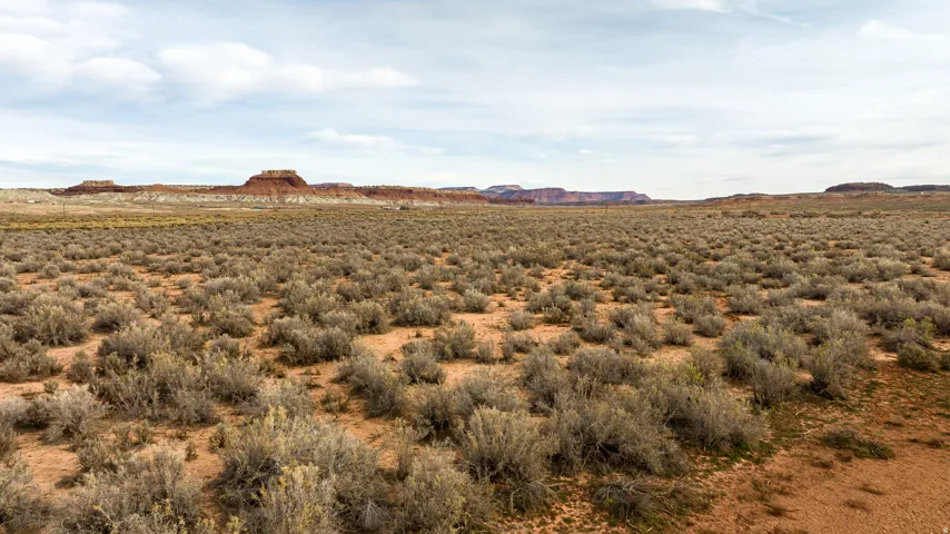 View of mountain backdrop featuring rural landscape