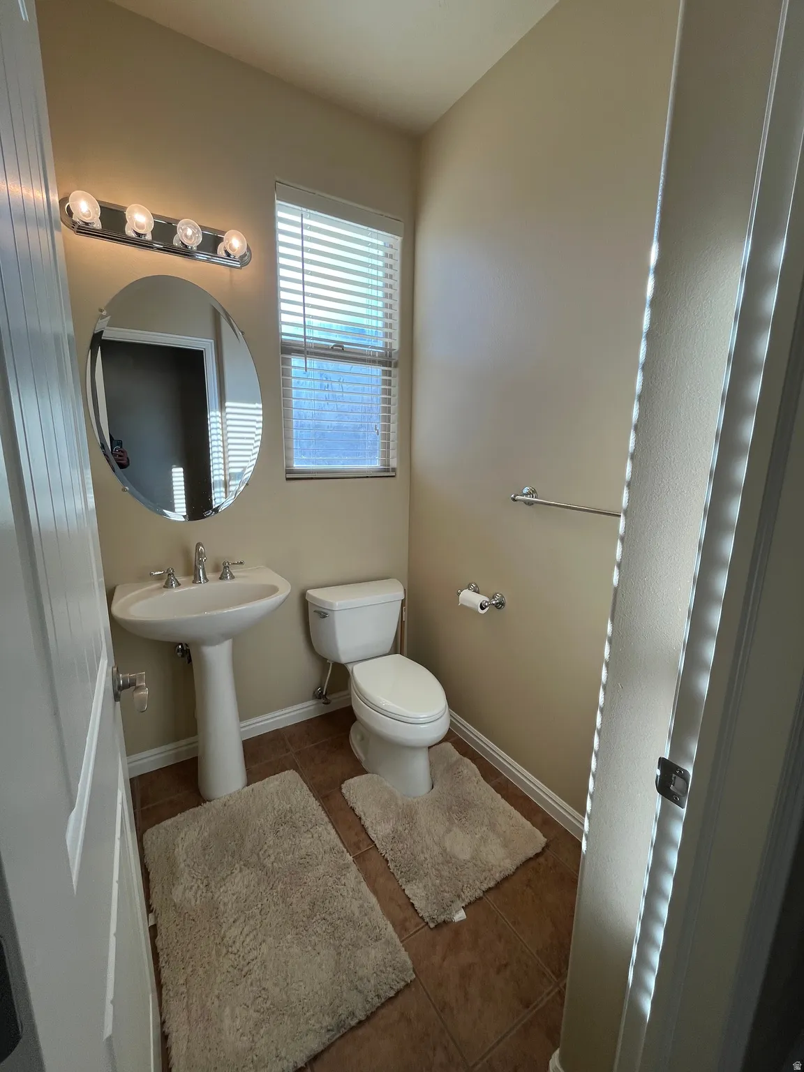 Bathroom featuring tile patterned floors and toilet