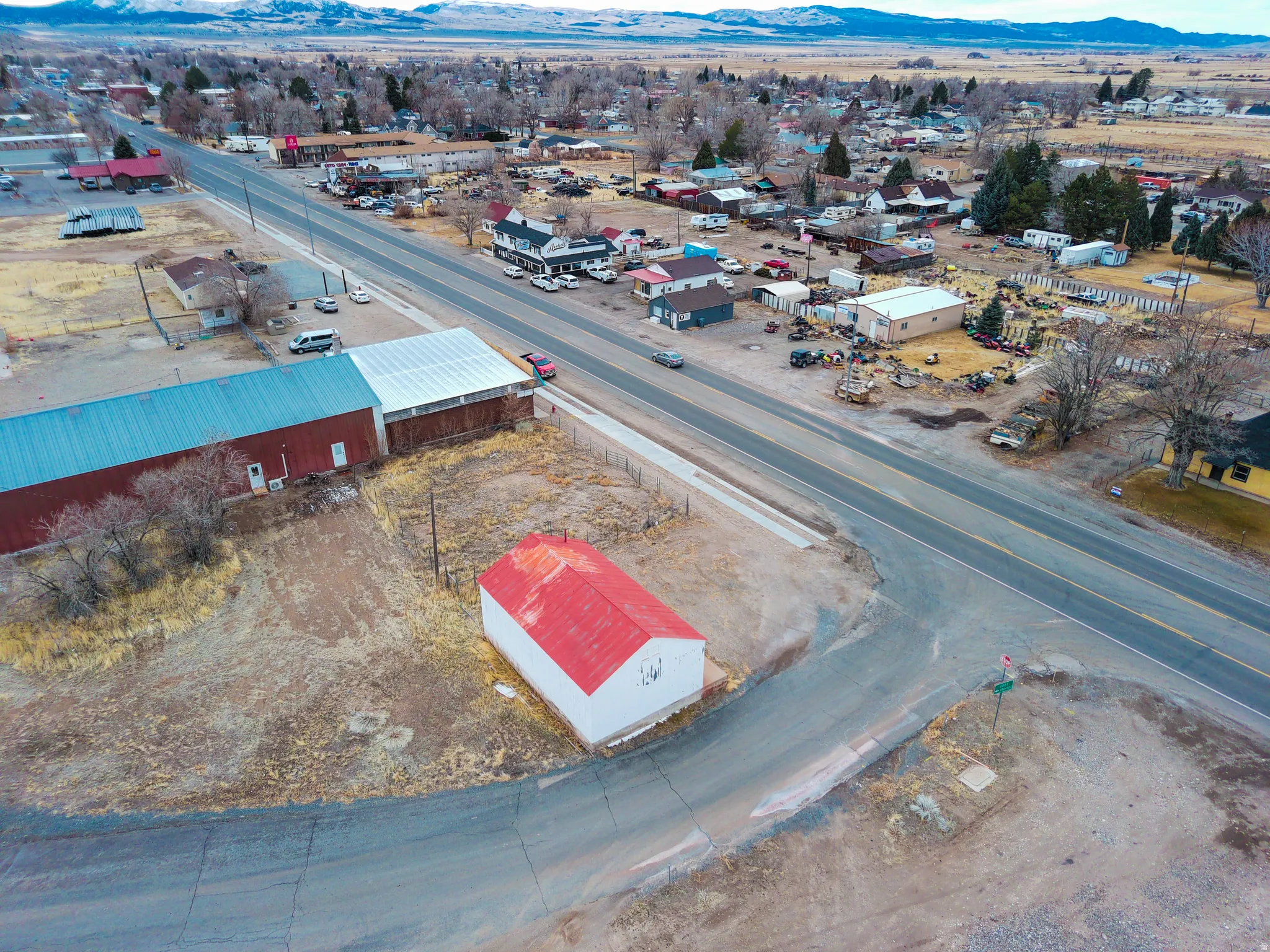 Drone / aerial view of an industrial area and a mountain backdrop