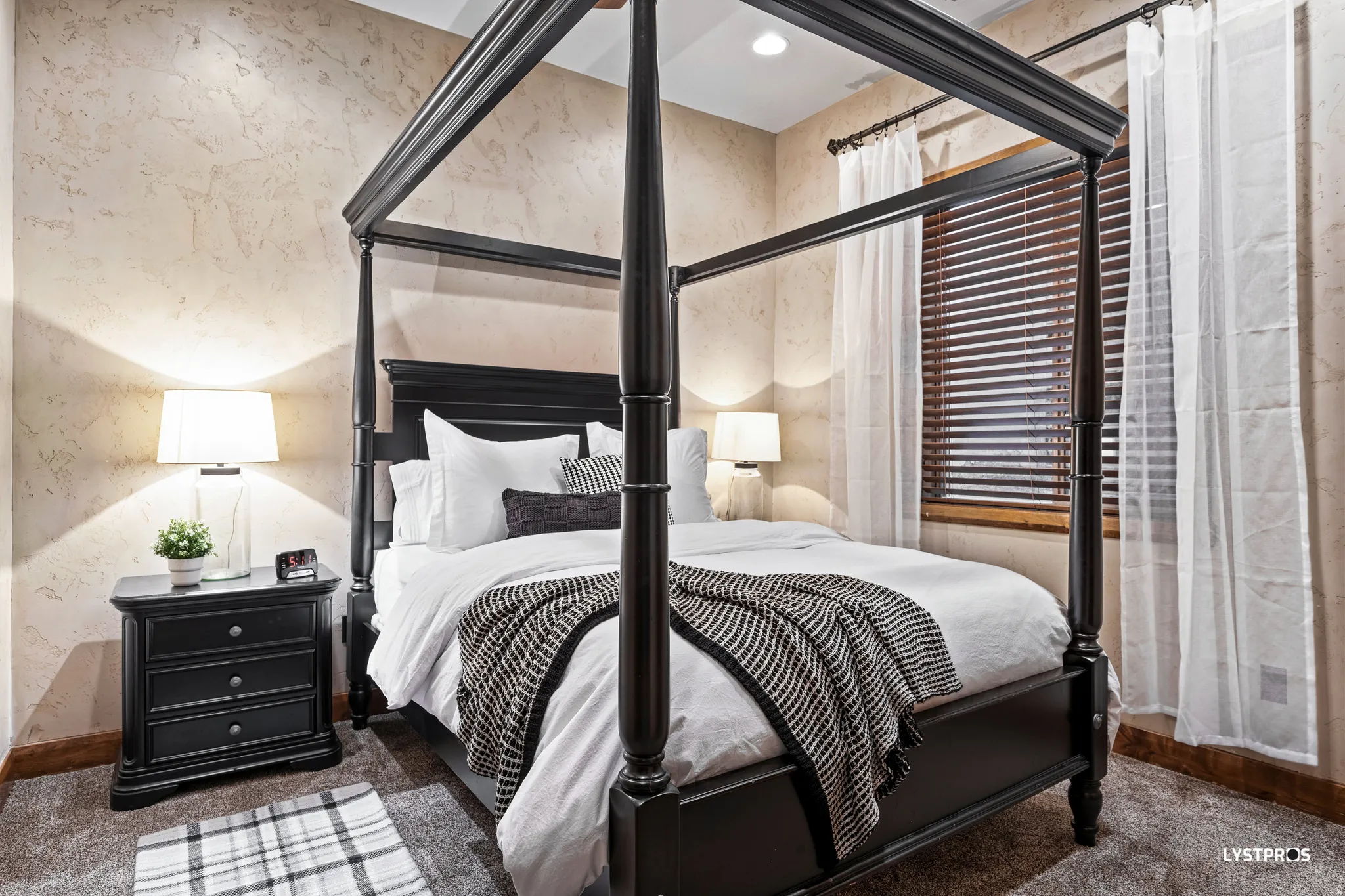 Bedroom featuring dark carpet