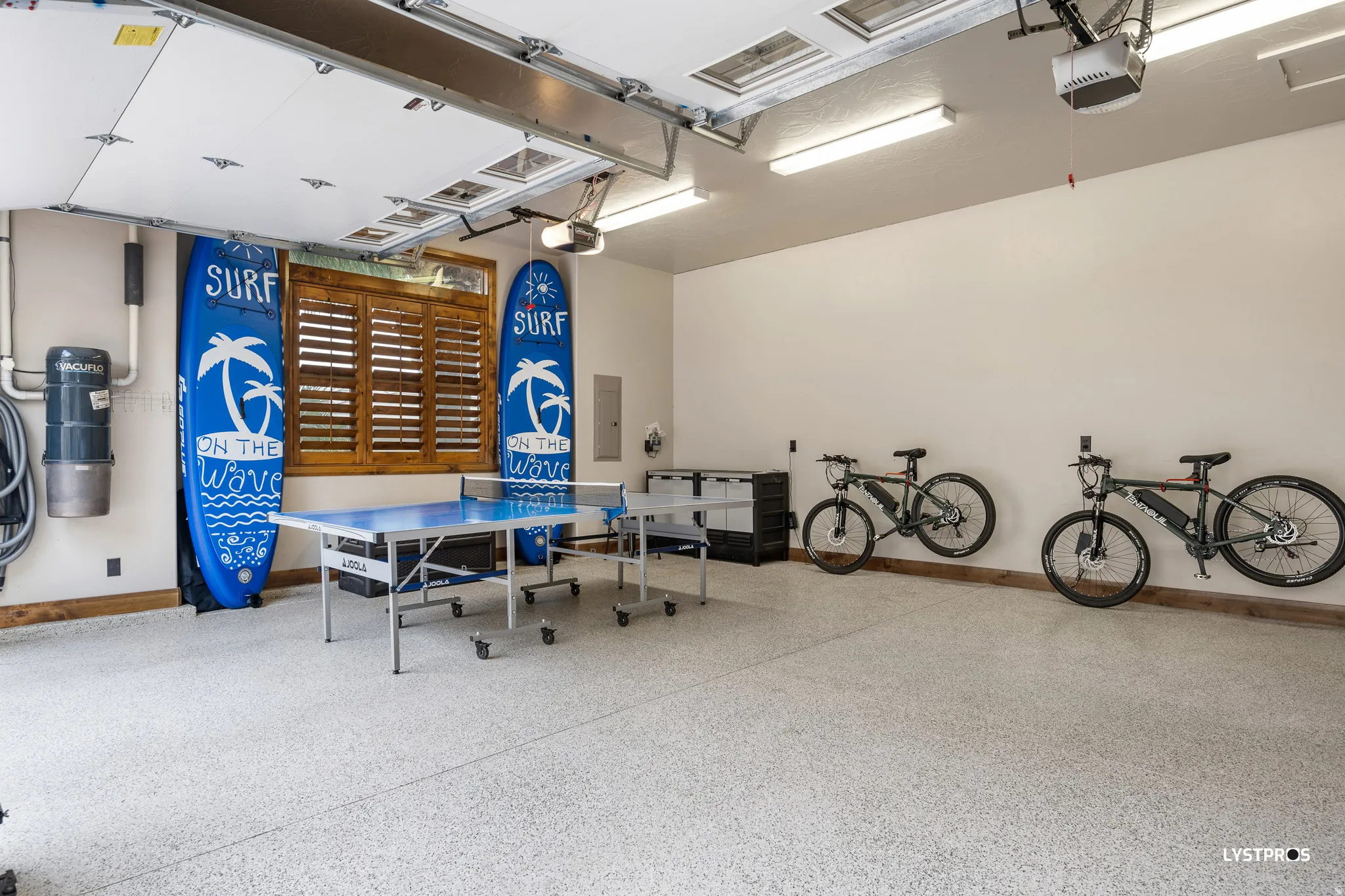 Garage with a garage door opener and electric panel