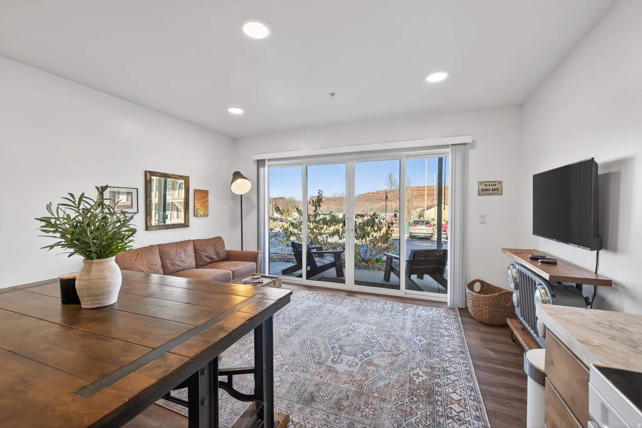 Living room featuring dark wood finished floors and recessed lighting