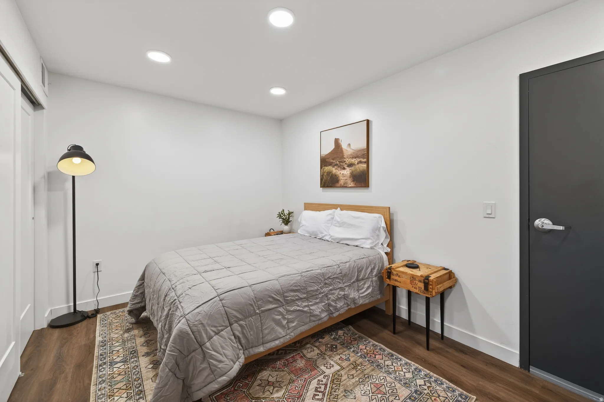 Bedroom with recessed lighting and dark wood finished floors