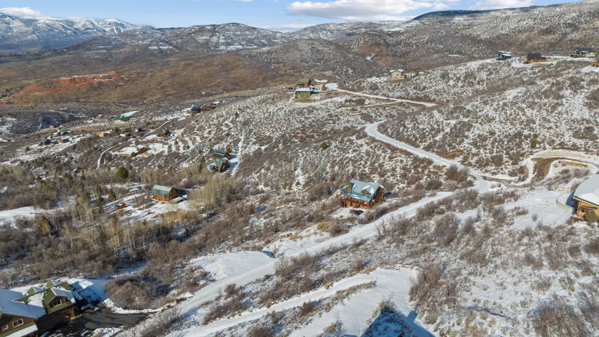Snowy aerial view featuring a mountain view