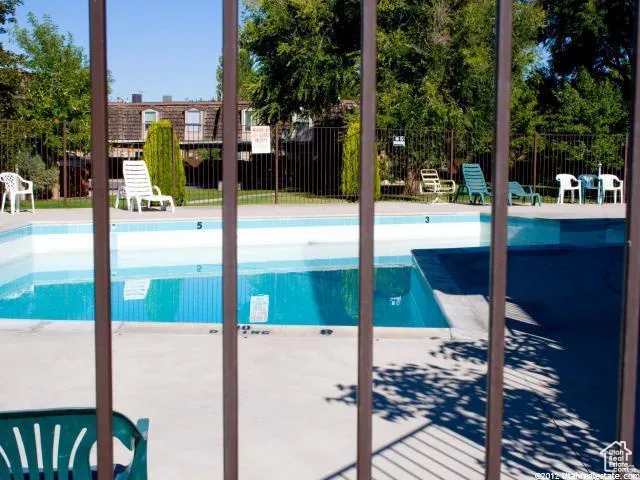 Community pool with a patio area