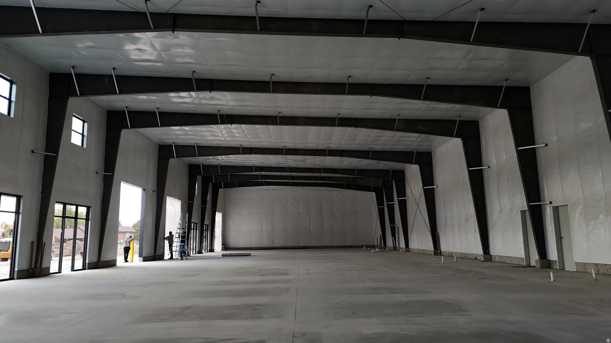 Misc room featuring a towering ceiling