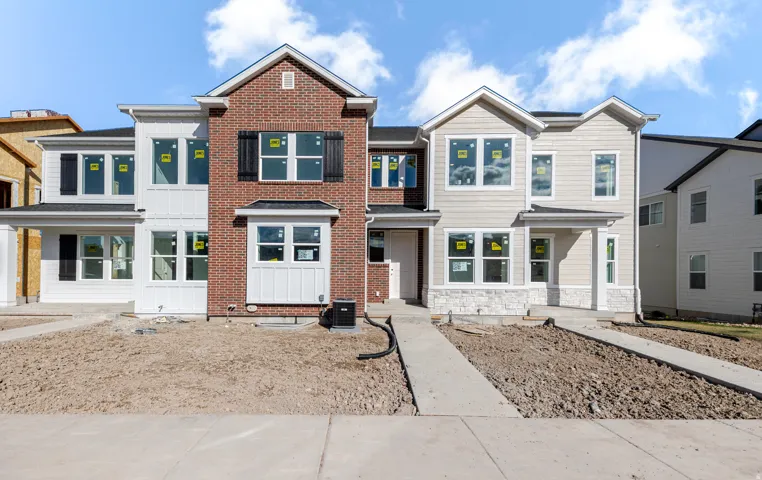 Contemporary house featuring board and batten siding and stone siding