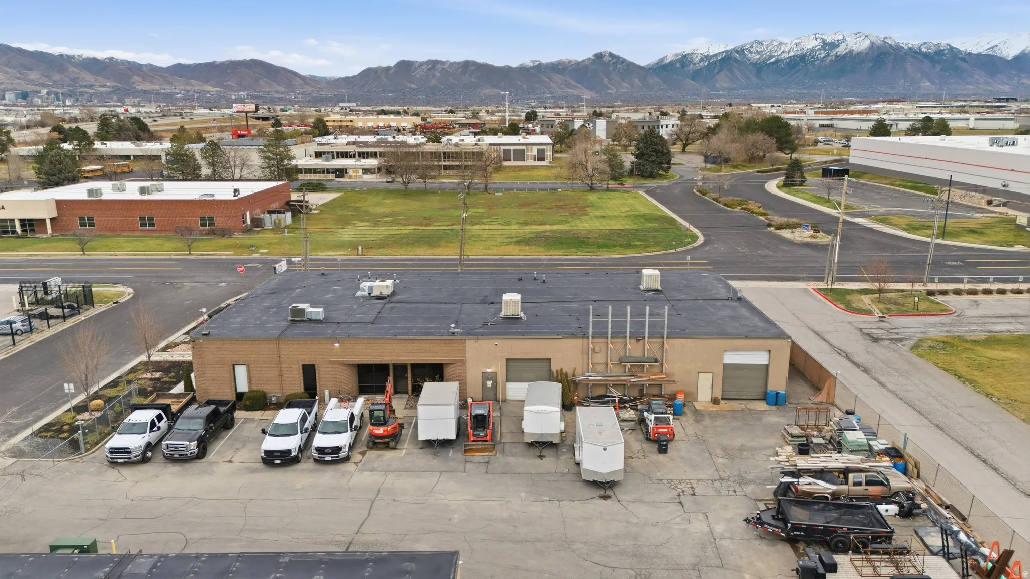 Bird's eye view of a mountain backdrop and an industrial area