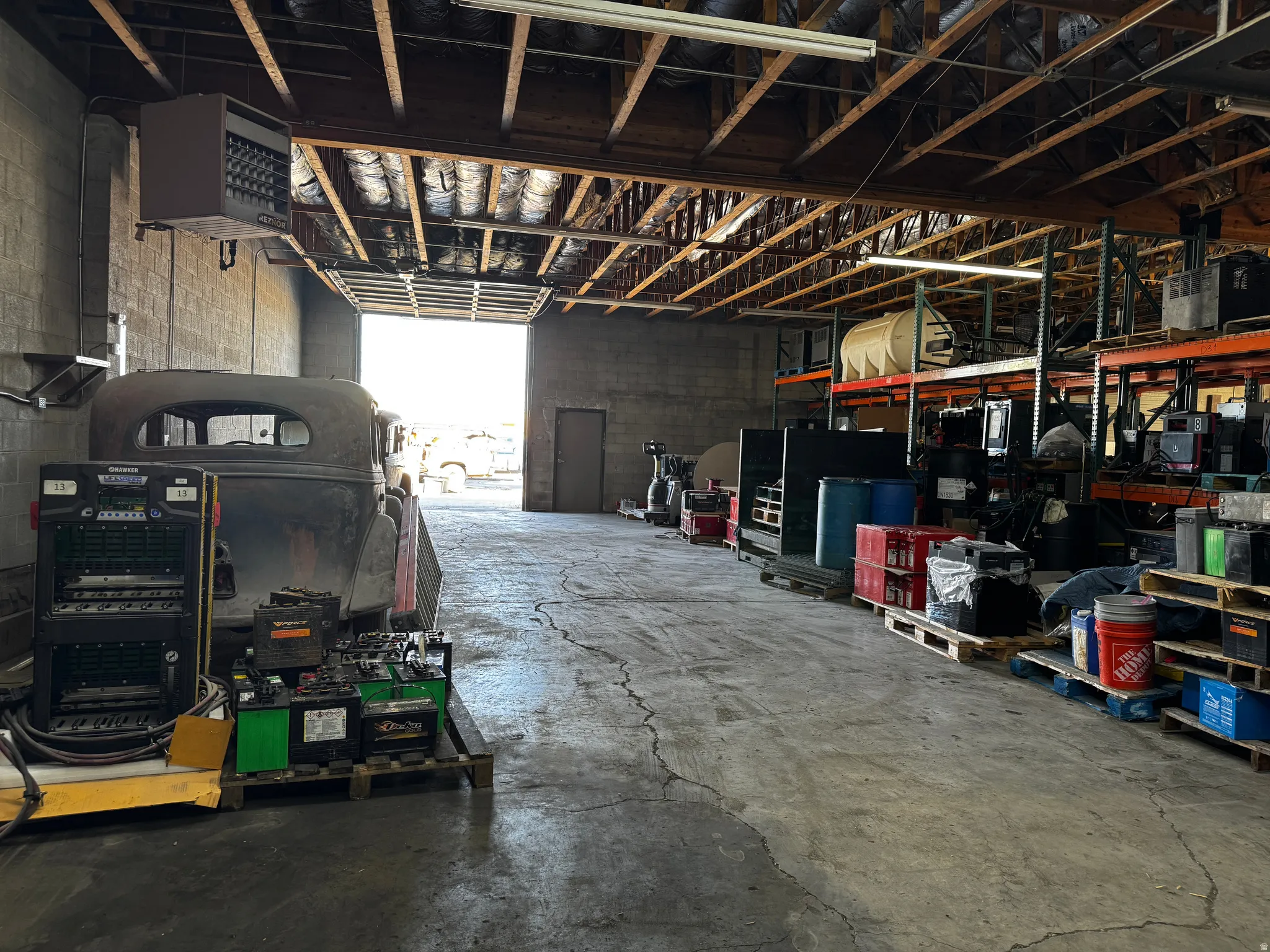 Misc room featuring a heating unit and a garage