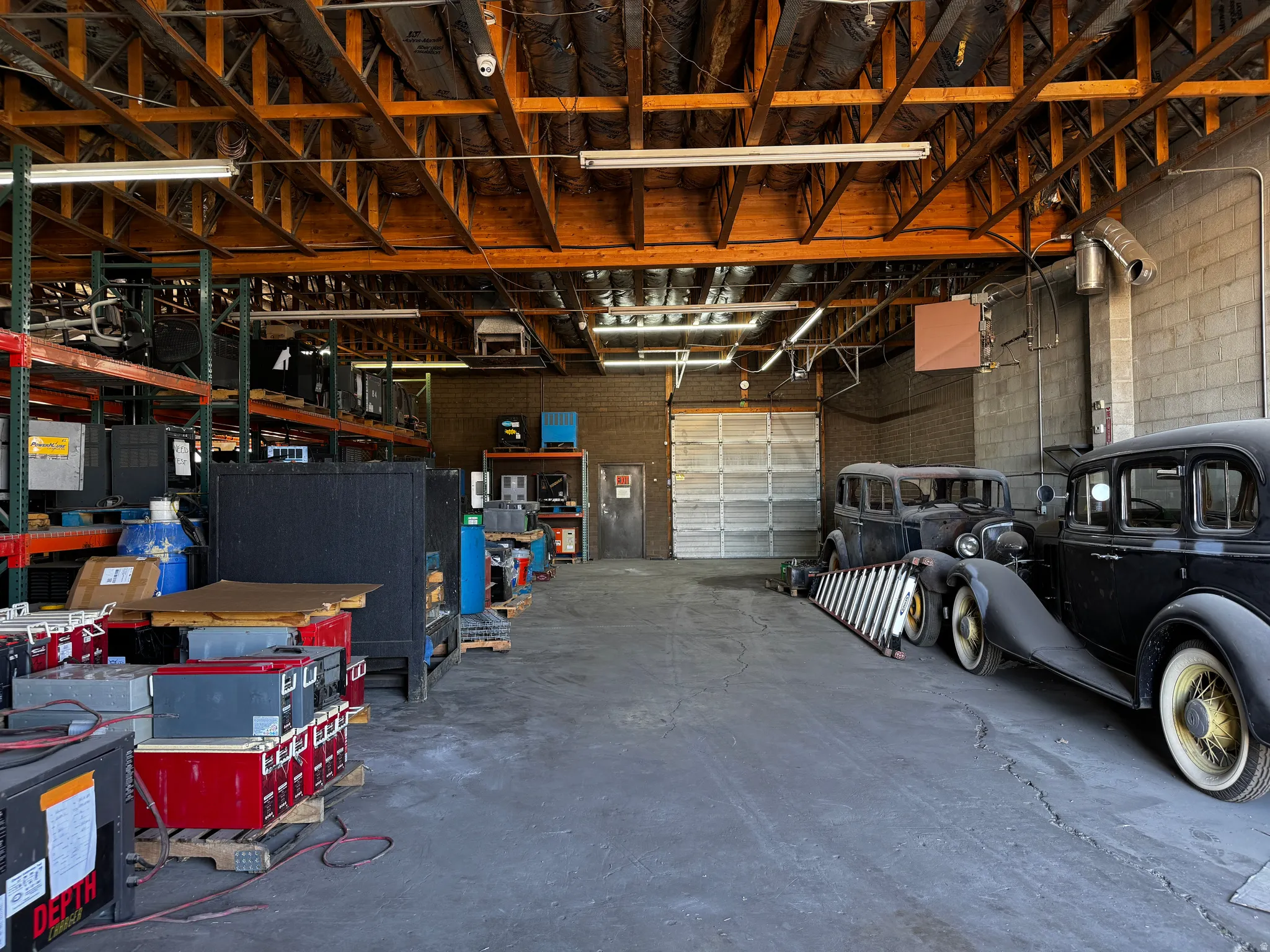 Garage with a heating unit and concrete block wall
