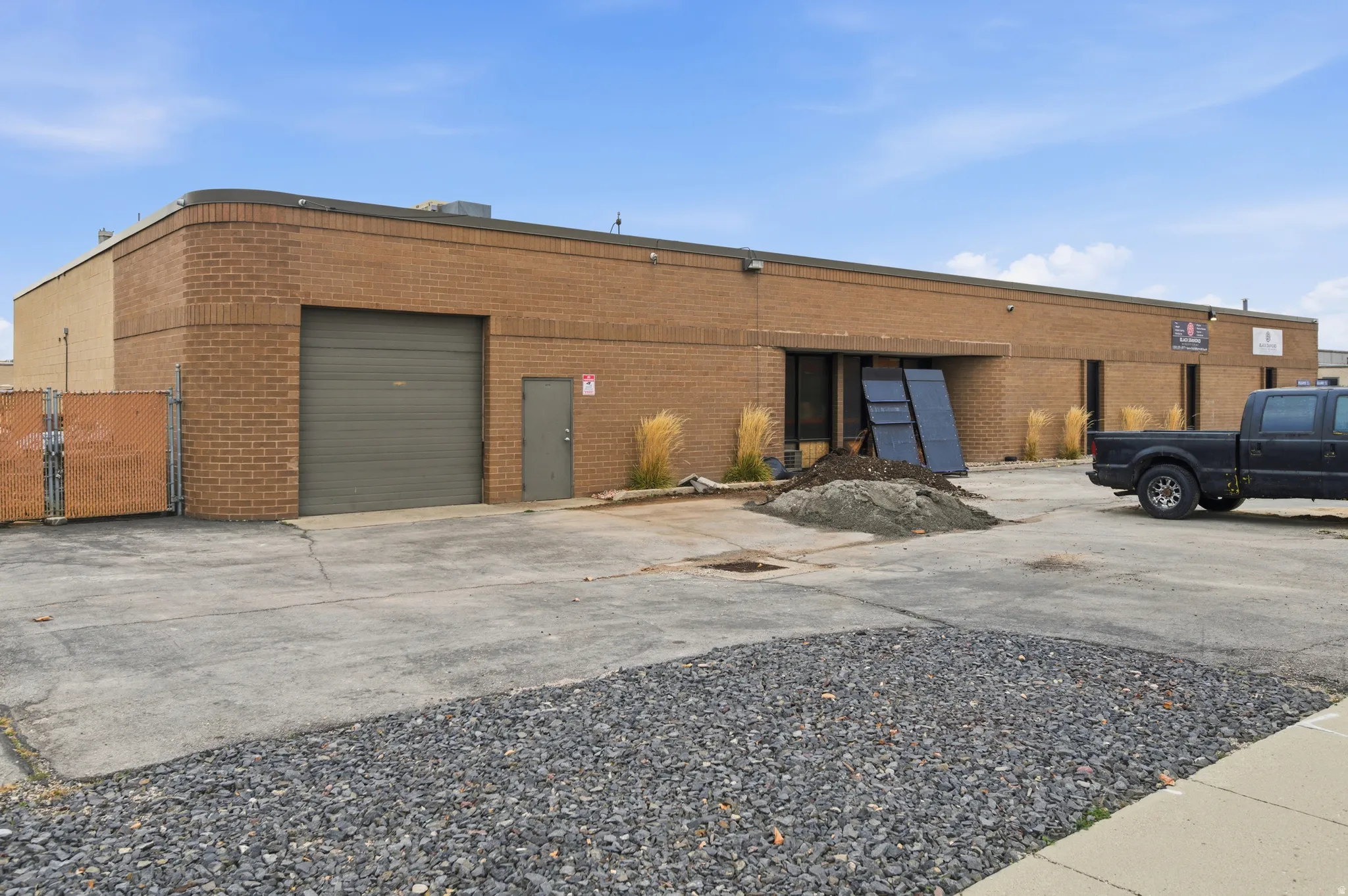 View of property featuring driveway