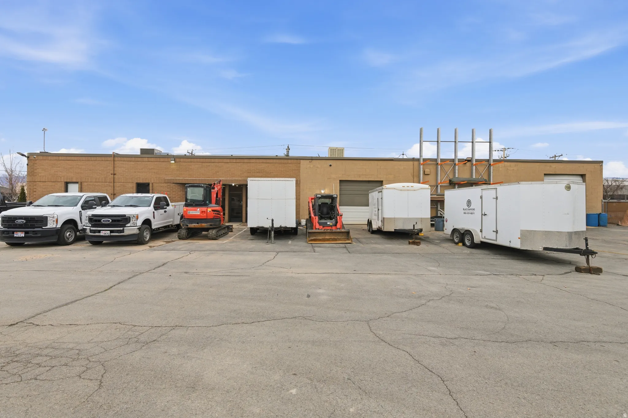 View of commercial location featuring uncovered parking