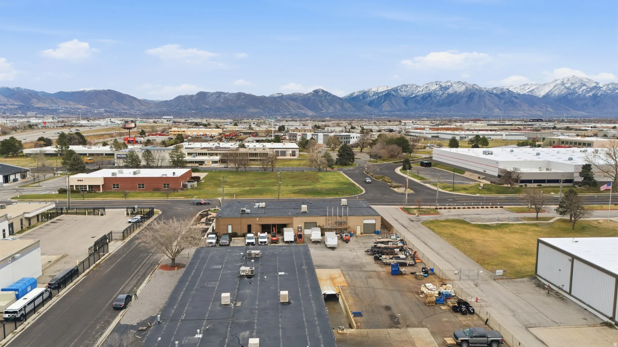 Aerial view of an industrial area and a mountain backdrop