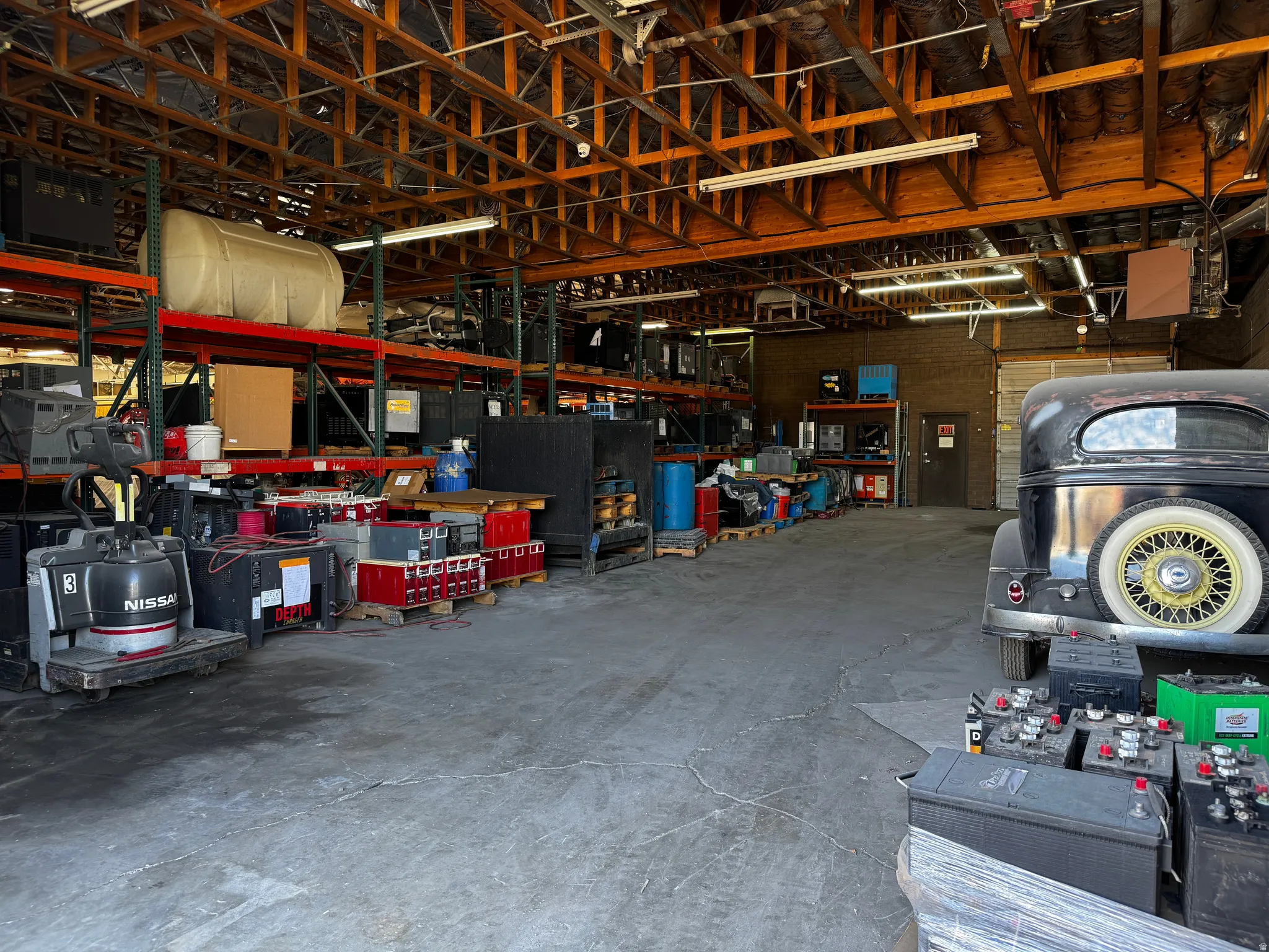 Garage featuring a heating unit