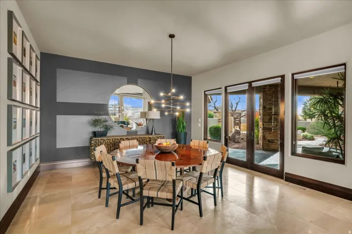 Dining room featuring french doors and a chandelier