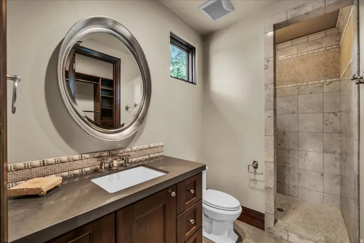 Full bath featuring vanity and a walk in shower