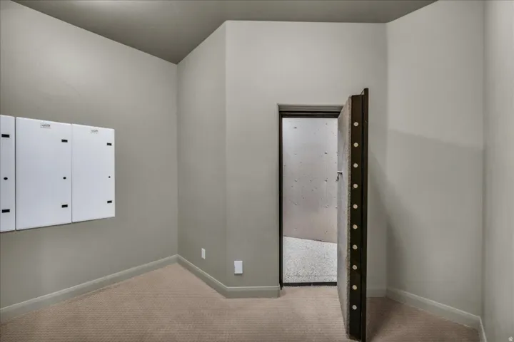 Unfurnished bedroom featuring carpet floors and baseboards